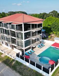 an aerial view of a building with a swimming pool at The Alexandria Marquis Hotel and Resort in San Ignacio