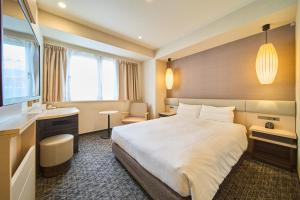Voodi või voodid majutusasutuse Via inn Kyoto Shijomuromachi toas