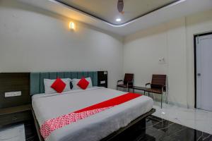A bed or beds in a room at BHILVA INN