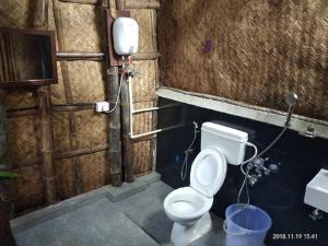 a bathroom with a toilet and a sink at Martsemik Camping & Resort Shachukul in Tangtse