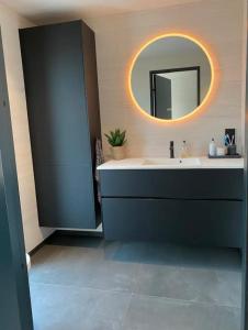 a bathroom with a sink and a mirror at Ny hytte i Malangen in Nordby