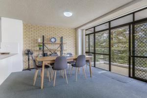 a dining room with a table and chairs at Tasman Towers 5 3 Munster Street in Port Macquarie