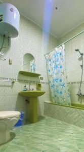 a bathroom with a toilet and a sink and a mirror at Seven Pyramids view inn in Cairo