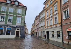 a cobblestone street in a city with buildings at La Mia Casa STARE MIASTO Warszawa in Warsaw