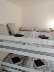two bunk beds with pillows on top of them at FEWO Kliff Watt Nr.4 in Cuxhaven +12 photos