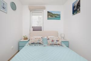 Posteľ alebo postele v izbe v ubytovaní Feniks SPA Apartments 10 by Jantar Apartamenty Kołobrzeg + 37 fotografií
