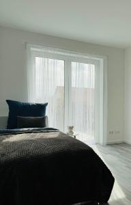 Postel nebo postele na pokoji v ubytování Apartment Weikersheim IV