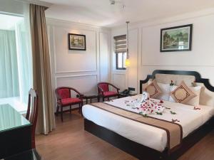 Postel nebo postele na pokoji v ubytování Coecco Xieng Khouang Hotel + 37 fotografií