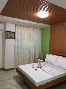 Ліжко або ліжка в номері GBU Loboc River Guesthouse