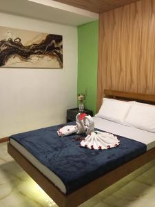 Ein Bett oder Betten in einem Zimmer der Unterkunft GBU Loboc River Guesthouse