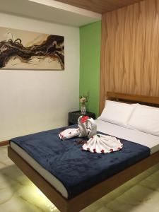 Ліжко або ліжка в номері GBU Loboc River Guesthouse