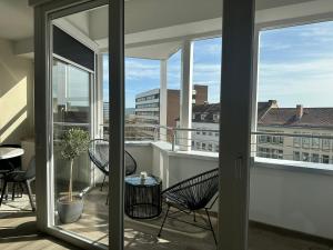 a balcony with a view of a city skyline at Ferienwohnung Kassel City in Kassel