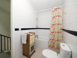 a bathroom with a toilet and a shower curtain at Plaza Mercadal, Tudela in Tudela +32 photos