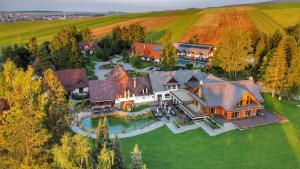 an aerial view of a large house at Oravský Háj Garden Hotel & Resort in Trstená