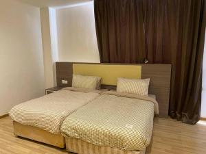 a bedroom with two beds in a room at Entire Room in Ayer Keroh in Ayer Keroh