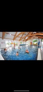 a group of people swimming in a swimming pool at regent bay in Morecambe