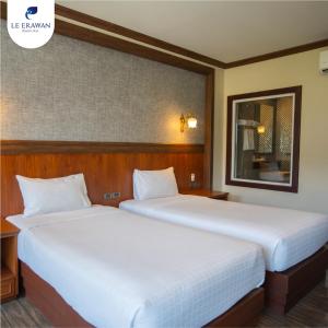 Le Erawan Phang Nga Hotel客房内的一张或多张床位