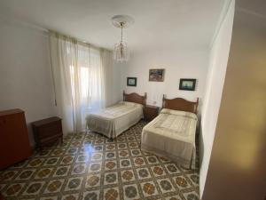 Un pat sau paturi într-o cameră la Casa Virgen de Gracia