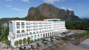 a rendering of a hotel with a mountain in the background at Le Erawan Phang Nga Hotel in Phangnga