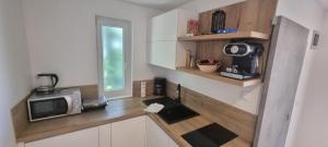 Kuchyň nebo kuchyňský kout v ubytování Villa Mediterranea - Apartments