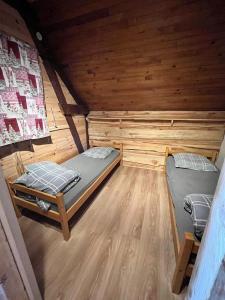 an overhead view of two beds in a cabin at Refuge de la banne in Murat-le-Quaire