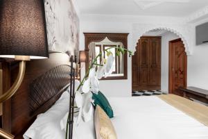 Posteľ alebo postele v izbe v ubytovaní Hotel Boutique Las Almenas