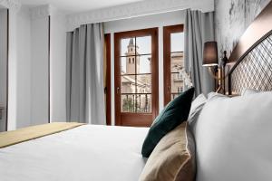 Posteľ alebo postele v izbe v ubytovaní Hotel Boutique Las Almenas