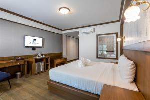 Le Erawan Phang Nga Hotel客房内的一张或多张床位