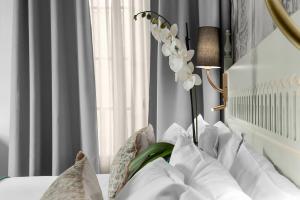 Posteľ alebo postele v izbe v ubytovaní Hotel Boutique Las Almenas