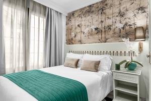 Posteľ alebo postele v izbe v ubytovaní Hotel Boutique Las Almenas