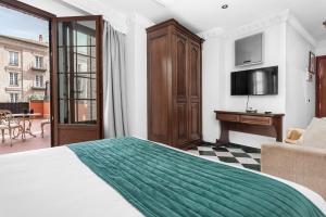Televízia a/alebo spoločenská miestnosť v ubytovaní Hotel Boutique Las Almenas