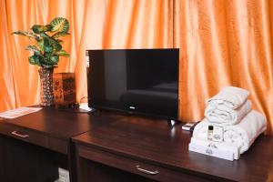 A television and/or entertainment centre at Manaya Residency