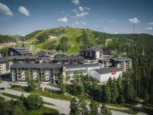an aerial view of a city with a mountain at Ski-Inn RukaSuites in Ruka