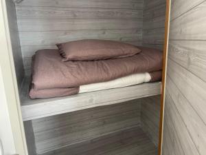 Postel nebo postele na pokoji v ubytování OKAERI築地町
