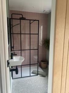 a bathroom with a shower and a sink in it at Braemar House in Fort William