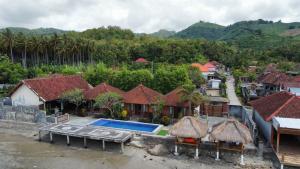 an aerial view of a house with a swimming pool at Krisna Bungalows and Restaurant in Sekotong