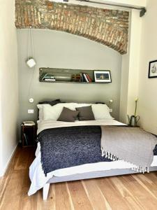 a bedroom with a large bed in a room at Loft G Hospitality in Milan