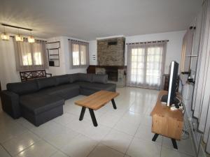 a living room with a couch and a table at Casa Llançà, 4 dormitorios, 8 personas - ES-228-133 in Llança