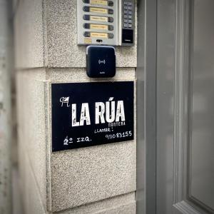 a sign on the side of a building at Hostal La Rúa-Montera in Madrid