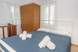 Posteľ alebo postele v izbe v ubytovaní Islanders Yard Apartments
