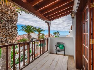 a balcony with a view of the ocean at Bungalow Fairway Village in Golf del Sur in San Miguel de Abona