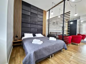 Ένα ή περισσότερα κρεβάτια σε δωμάτιο στο Wieczorek Apartment