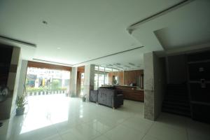 a lobby of a building with a large window at HOTEL ROI INN in Tirupati