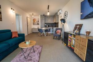 a living room with a couch and a table at Luxury Apartment Marija in Novalja