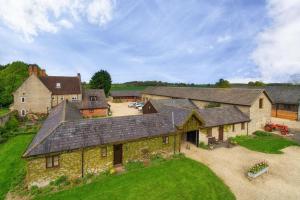 an aerial view of a large house with a yard at Well Cottage - Compact & Cosy! in Buckinghamshire