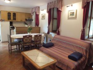 a living room with a couch and a table at Villa Plavo more Fiorini in Umag