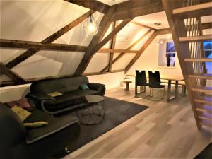 a living room with a couch and chairs and a table at Ferienwohnung "beim Schrimpf" in Schongau +18 photos