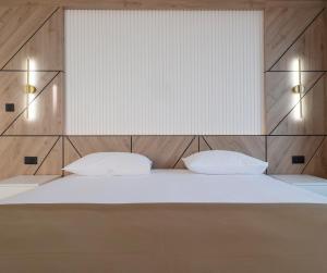 מיטה או מיטות בחדר ב-Hotel Tara Becici