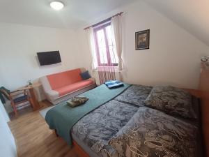 Postel nebo postele na pokoji v ubytování Pension Orbis
