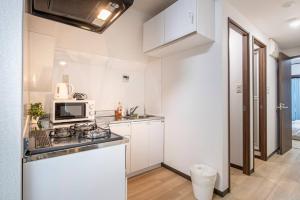 Köök või kööginurk majutusasutuses Uhome Tabata Apartment